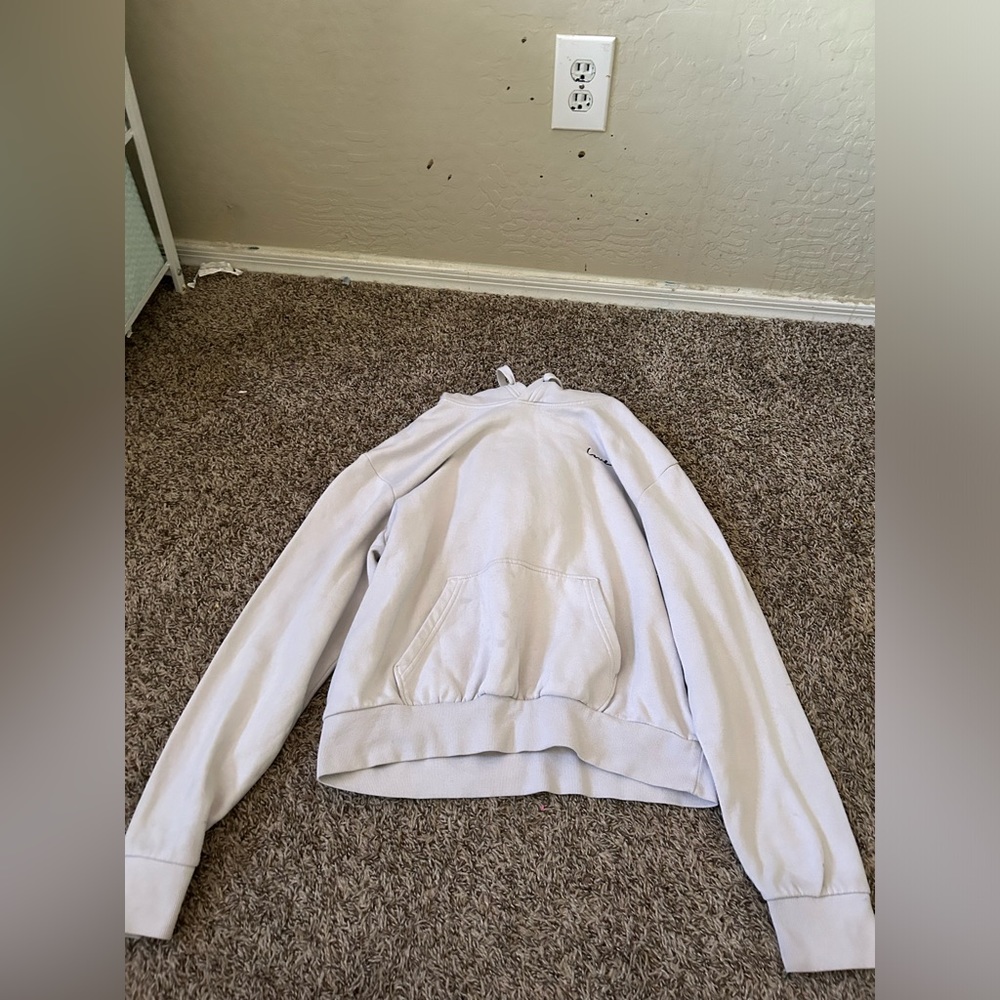White Hoodie Says Love in the corner